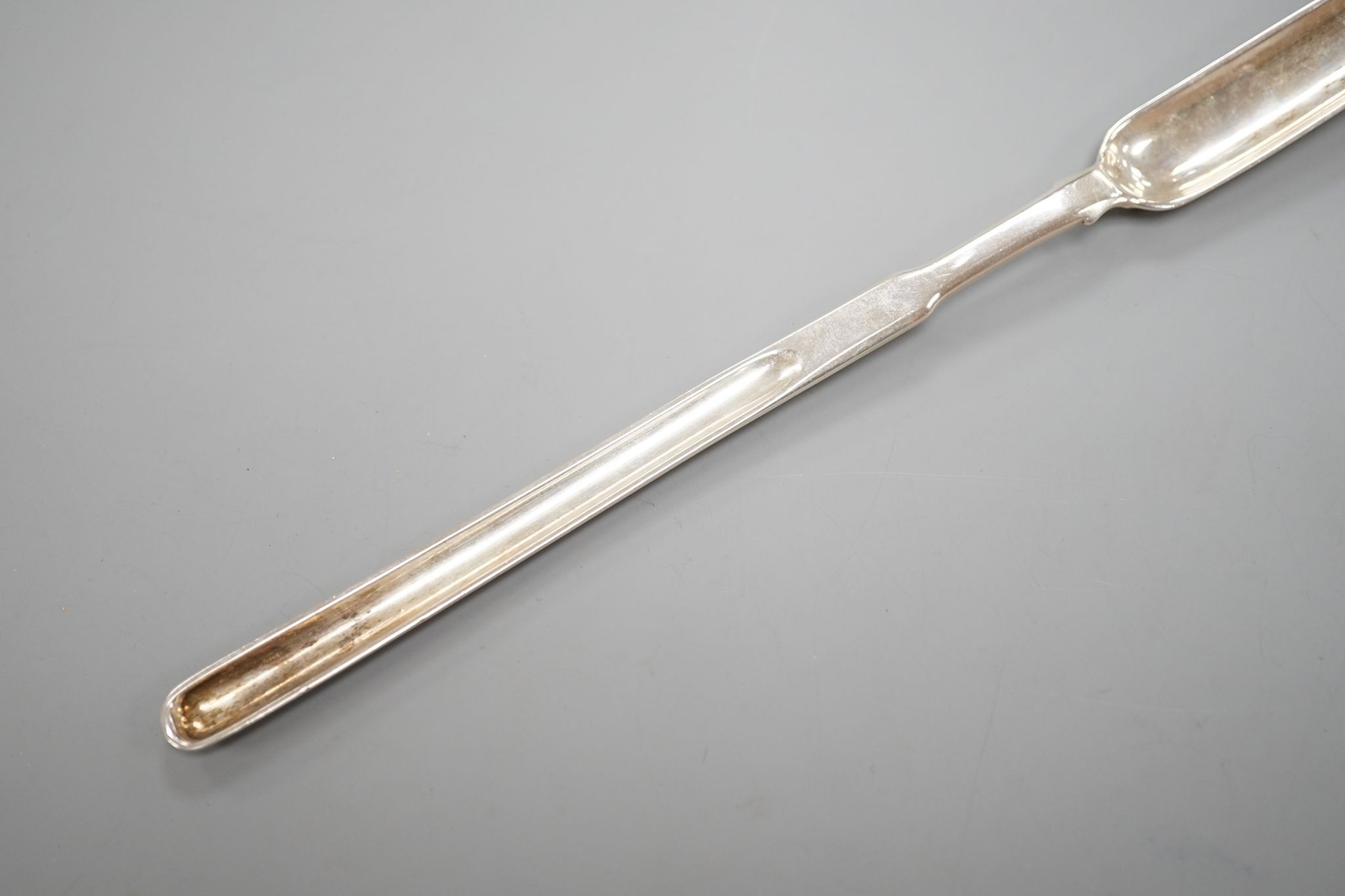 A George III silver marrow scoop, with engraved crest, Peter & William Bateman, London, 1810, 24.6cm, 56 grams.